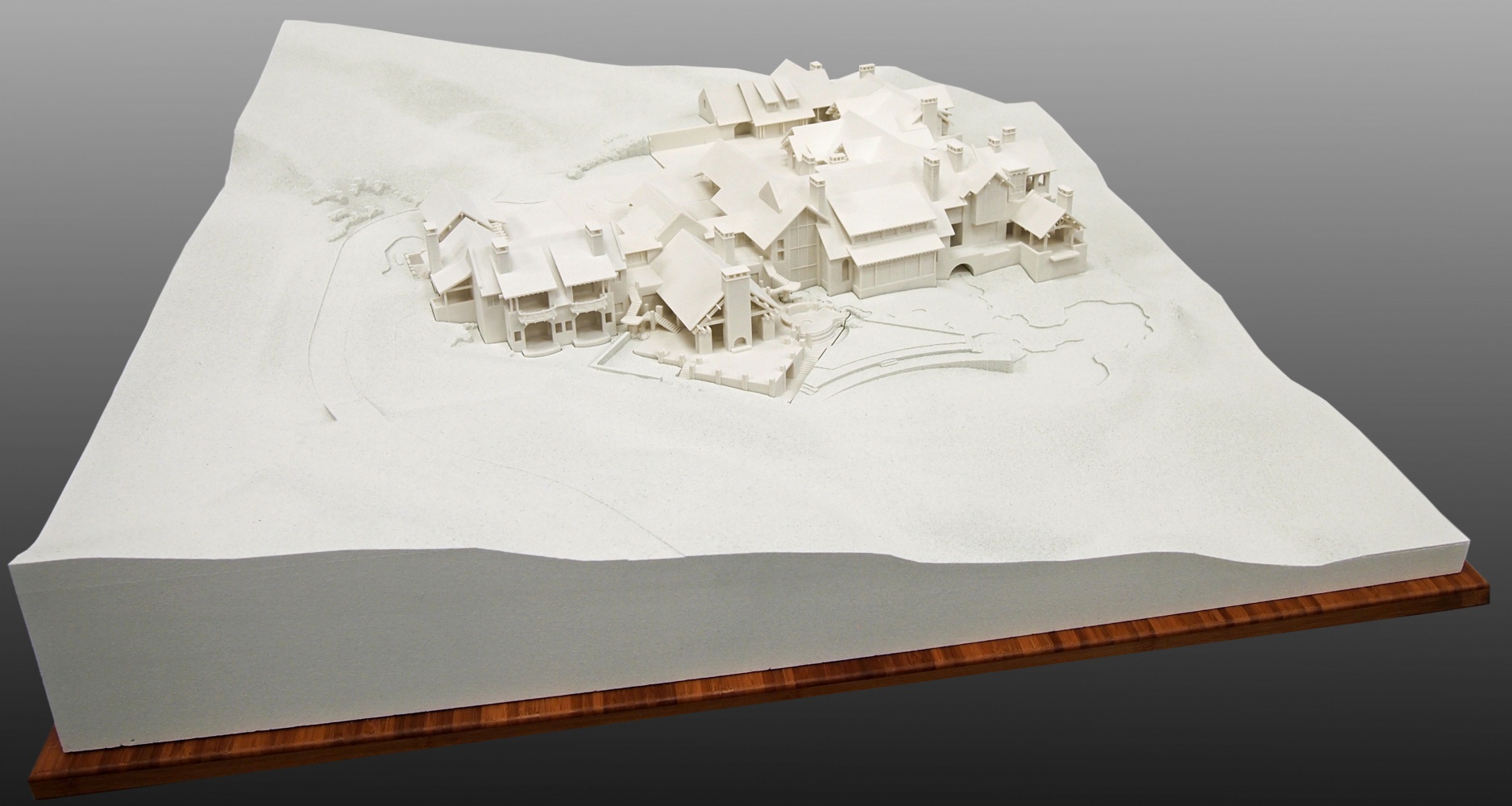 Multiple 3D Prints of a home set in to Milled Terrain Form