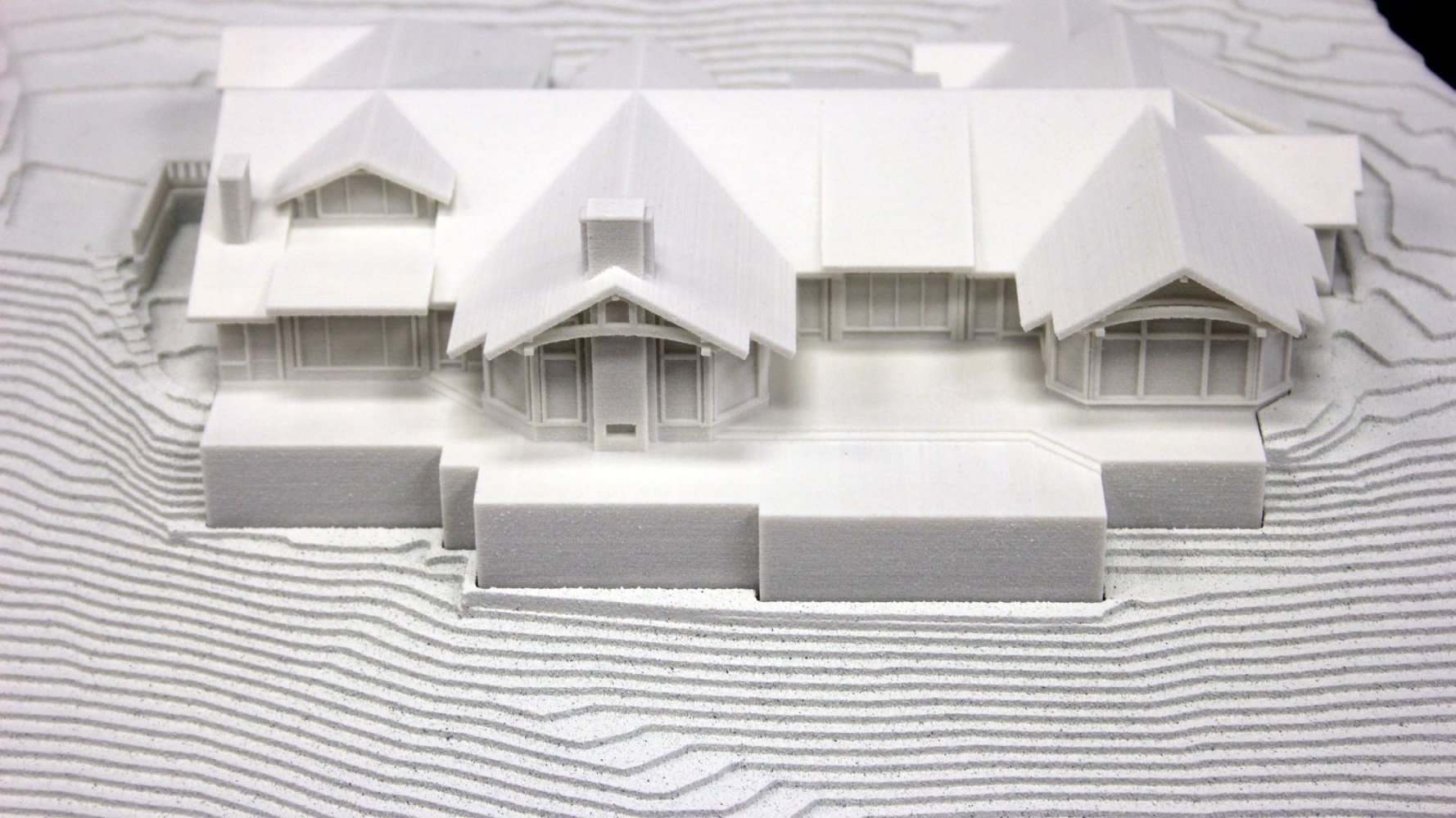 3D Printed Building integrated in to a stepped milled base