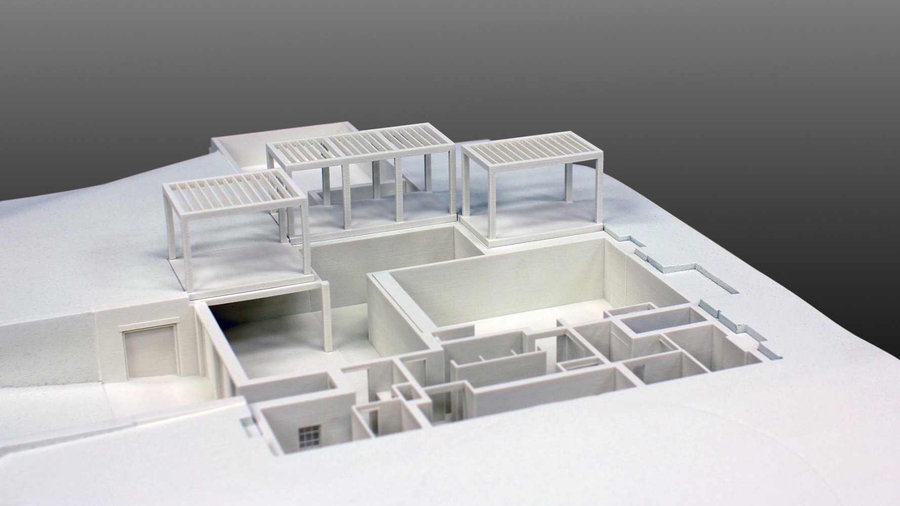 Quarter scale take-apart residential model, 3D printed from ArchiCAD geometry. The window details were laser cut and integrated with the building 3D prints. The site was CNC machined to accept the 3D prints.